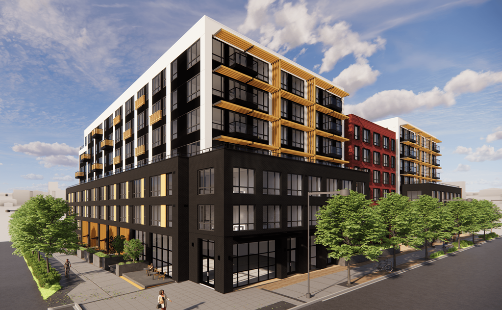 A modern multi-story building with black and red exterior and yellow accents.